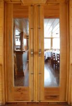 M/V Delfin I's cozy wood-paneled dining room, located on the Upper Deck, has panoramic windows and air-conditioning.
